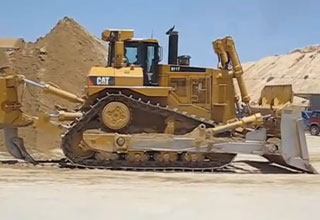 Bulldozers pushed over the sand